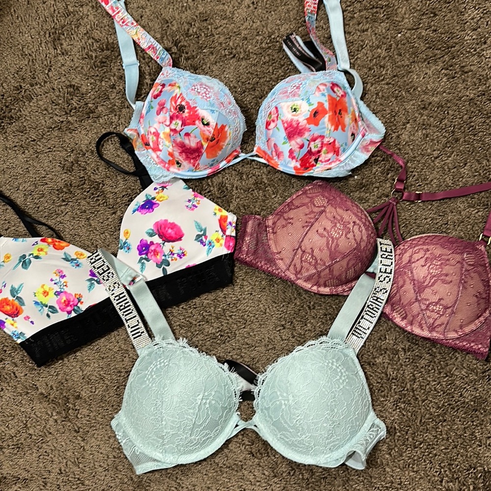 6 Victoria secret bra bundle. 5 34a bombshell bras. 1 32b sporty bra.